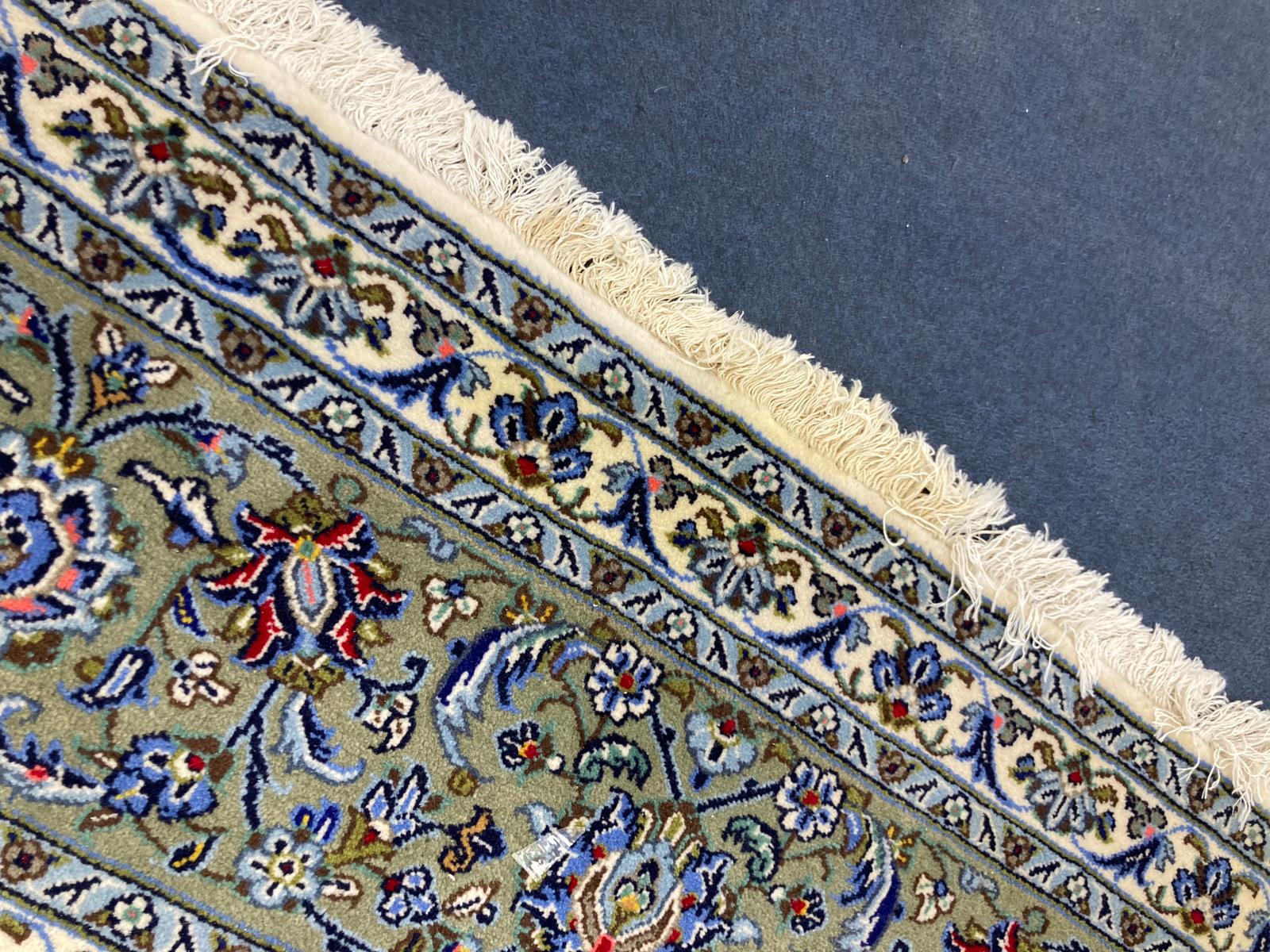 A North West Persian ivory ground carpet, 350 x 250cm